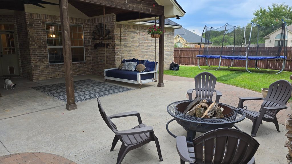 rustic covered patio design with a fire pit in college station, texas
