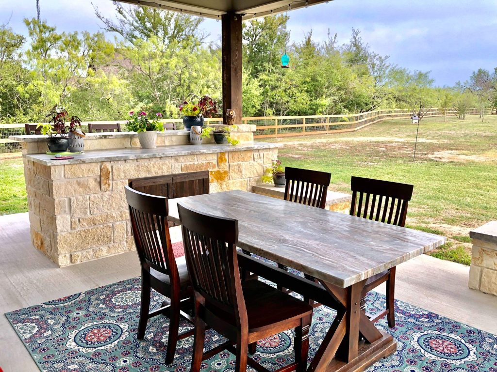 an Outdoor Bar and Outdoor Dining Area on a Covered Patio Extension
