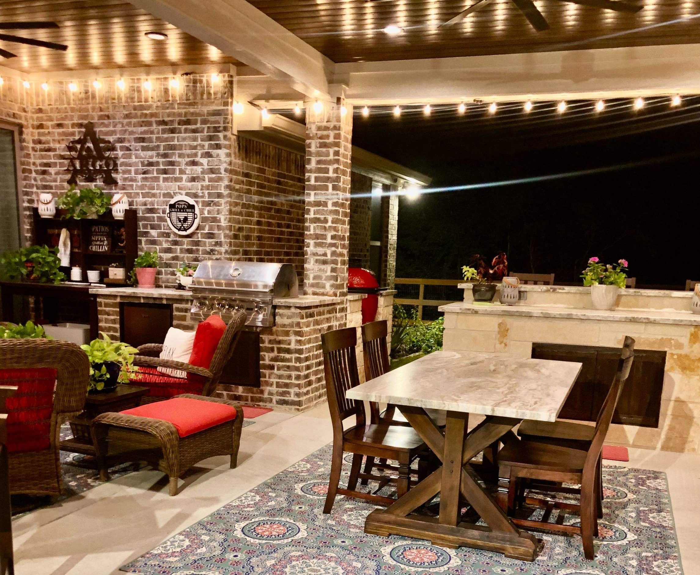 Contemporary patio design basics for a modern vibe tx | h3 outdoor design & construction | h3 outdoor design & construction Contemporary Patio Design with String Lights and Outdoor Dining Area in the Evening